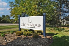 Farmington Hills apartment for rent - A sign for Stoneridge Apartments is displayed in front of a grassy area.