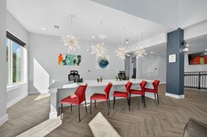 San Antonio apartment for rent - A dining room with a white table and red chairs.
