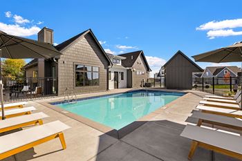 Resort-inspired pool with sundeck and lounge chairs