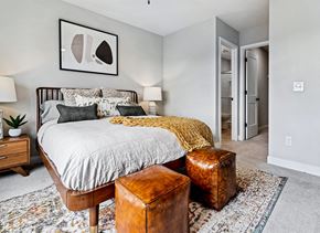 Maple Grove apartment for rent - a bedroom with a bed and a chair and a closet
