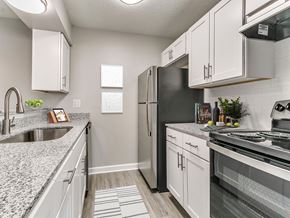 Urbandale apartment for rent - an updated kitchen with granite counter tops and stainless steel appliances