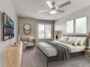 Urbandale apartment for rent - a bedroom with a bed and a ceiling fan