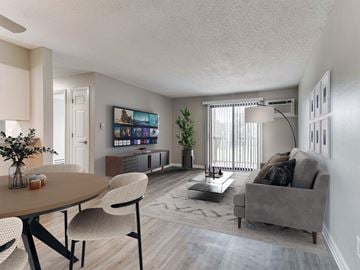 Urbandale apartment for rent - a living room and dining room with a couch and a table