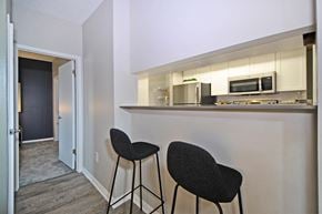 Holland apartment for rent - a kitchen with two stools in front of a counter top