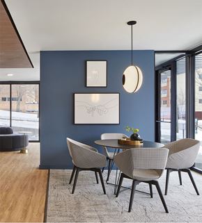 Saint Paul apartment for rent - A modern dining room with a round table and chairs.