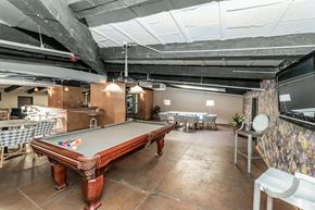 Chicago apartment for rent - a game room with a pool table and tables