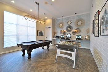 Game area with billiards and foosball