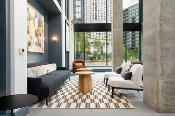Minneapolis apartment for rent - a living room with a couch and a table in front of a window