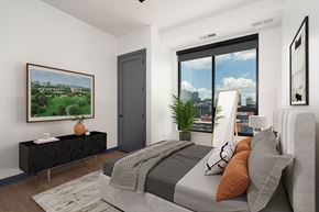 Minneapolis apartment for rent - a bedroom with a bed and a large window