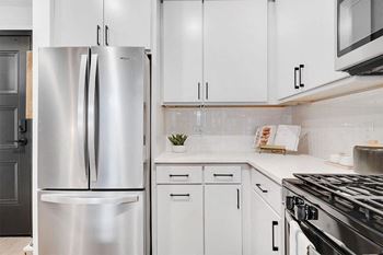 Name brand stainless steel appliances with gas range and french door refrigerators