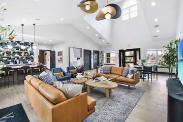 Howell apartment for rent - A living room with a brown sofa and a coffee table.