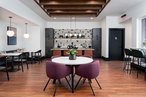 Highland Heights apartment for rent - A dining room with a white table and purple chairs.