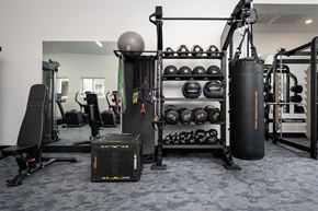 Highland Heights apartment for rent - A gym with a variety of equipment including weights and a punching bag.