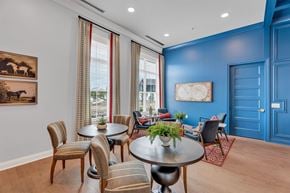 Perrysburg apartment for rent - A dining room with a table set for six and a view of the city.