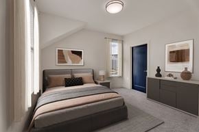 Perrysburg apartment for rent - A bedroom with a large bed and a blue door.