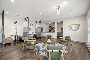 Chattanooga apartment for rent - A modern dining room with a round table and chairs.