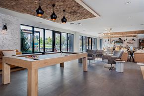 Ann Arbor apartment for rent - A modern dining room with a long wooden table and chairs.