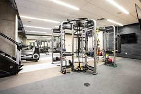 Minneapolis apartment for rent - A gym with a variety of equipment including treadmills, weights, and exercise machines.