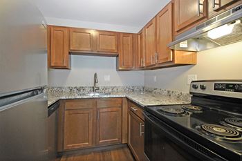 Wood shaker-style cabinetry* select apartments
