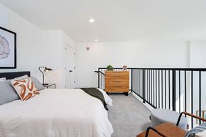 Pittsburgh apartment for rent - a bedroom with a bed and a railing