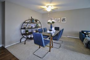 Lansing apartment for rent - A dining room with a round table and chairs.