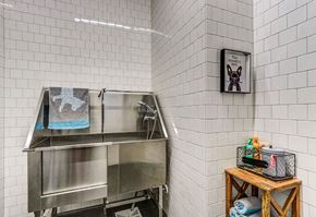 Cleveland apartment for rent - A kitchen area with a stainless steel sink and a wooden table with various items on it.