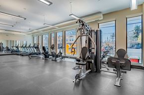 Cleveland apartment for rent - A gym with a variety of equipment including treadmills, weights, and exercise machines.