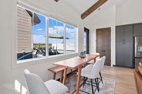 Blaine apartment for rent - A dining room with a table and chairs in front of a window.