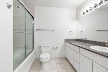 Tub/shower combination with sliding glass door