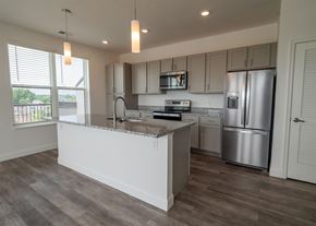 Columbus apartment for rent - A kitchen with a white counter and stainless steel appliances.