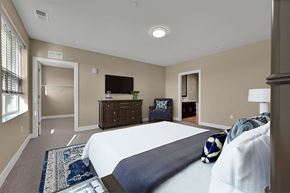 Highland Park apartment for rent - a bedroom with a bed and a dresser