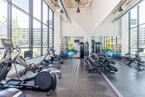 Cleveland apartment for rent - a gym with weights and cardio equipment and large windows