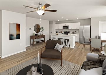 Urbandale apartment for rent - A modern living room with a brown chair in the center.