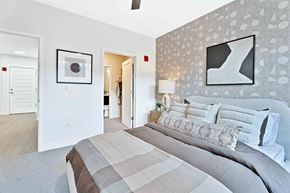 Roselle apartment for rent - A bedroom with a large bed and a painting on the wall.