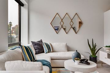 Saint Paul apartment for rent - A living room with a white couch and a coffee table.