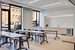 Saint Paul apartment for rent - A conference room with a long table and chairs.