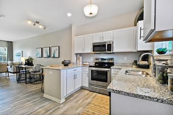 White shaker cabinets with chrome hardware