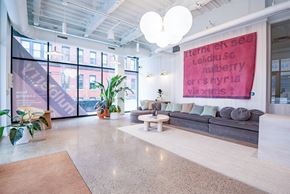 Pittsburgh apartment for rent - A brightly lit office space with a large banner on the wall.