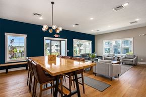 Rockford apartment for rent - A dining room with a wooden table and chairs.