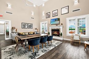 Ann Arbor apartment for rent - A dining room with a fireplace and a view of the outside.