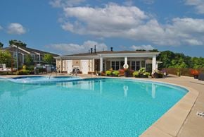 Ann Arbor apartment for rent - A large swimming pool in front of a house.