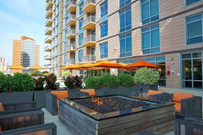 Cleveland apartment for rent - A modern building with a patio area in front.