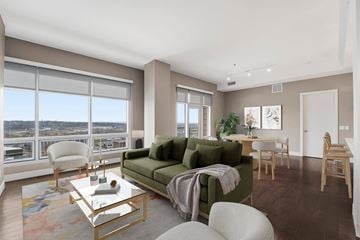 Cleveland apartment for rent - A living room with a green couch and a coffee table.