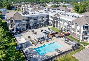Cincinnati apartment for rent - an aerial view of an apartment building with a swimming pool