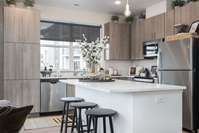 Cincinnati apartment for rent - a kitchen with a large island and three stools