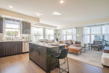Chaska apartment for rent - a living room with a kitchen and a couch