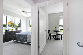 Troy apartment for rent - A bedroom with a bed and a chair in it.