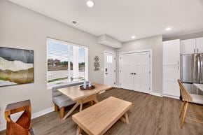 West Des Moines apartment for rent - A modern dining room with a wooden table and chairs.