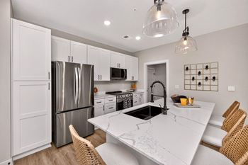 White shaker-style soft-close cabinetry