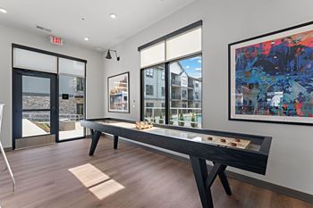 Community lounge with shuffleboard & kitchenette